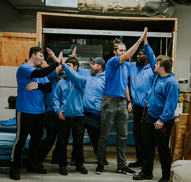 Planes employees celebrating a successful move