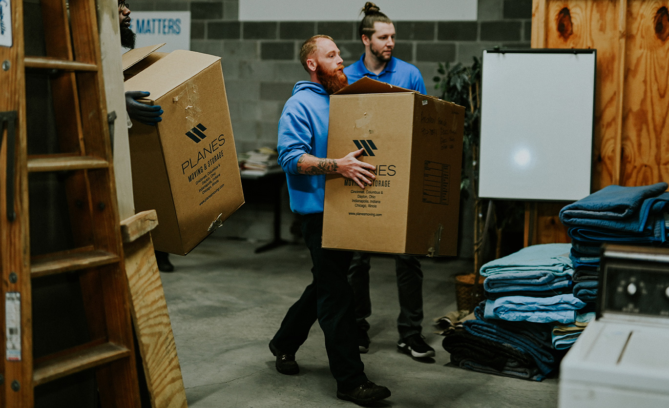 Employees moving boxes