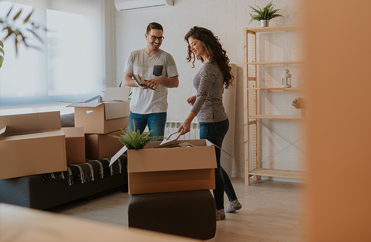 couple packing moving boxes