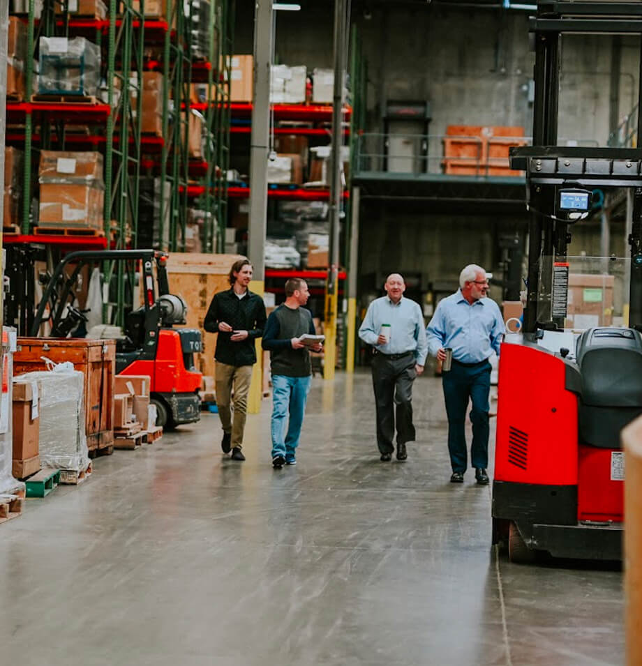 Employees walking through Planes warehouse