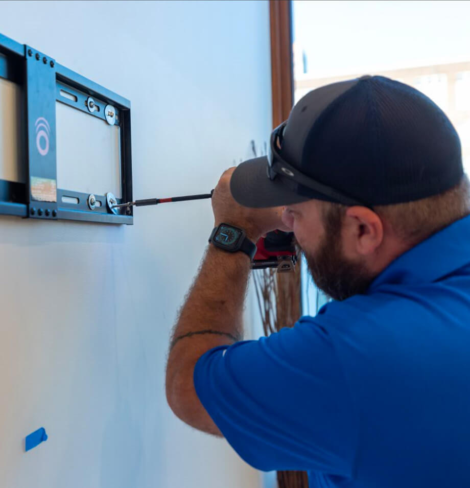 Planes employee removing wall mount