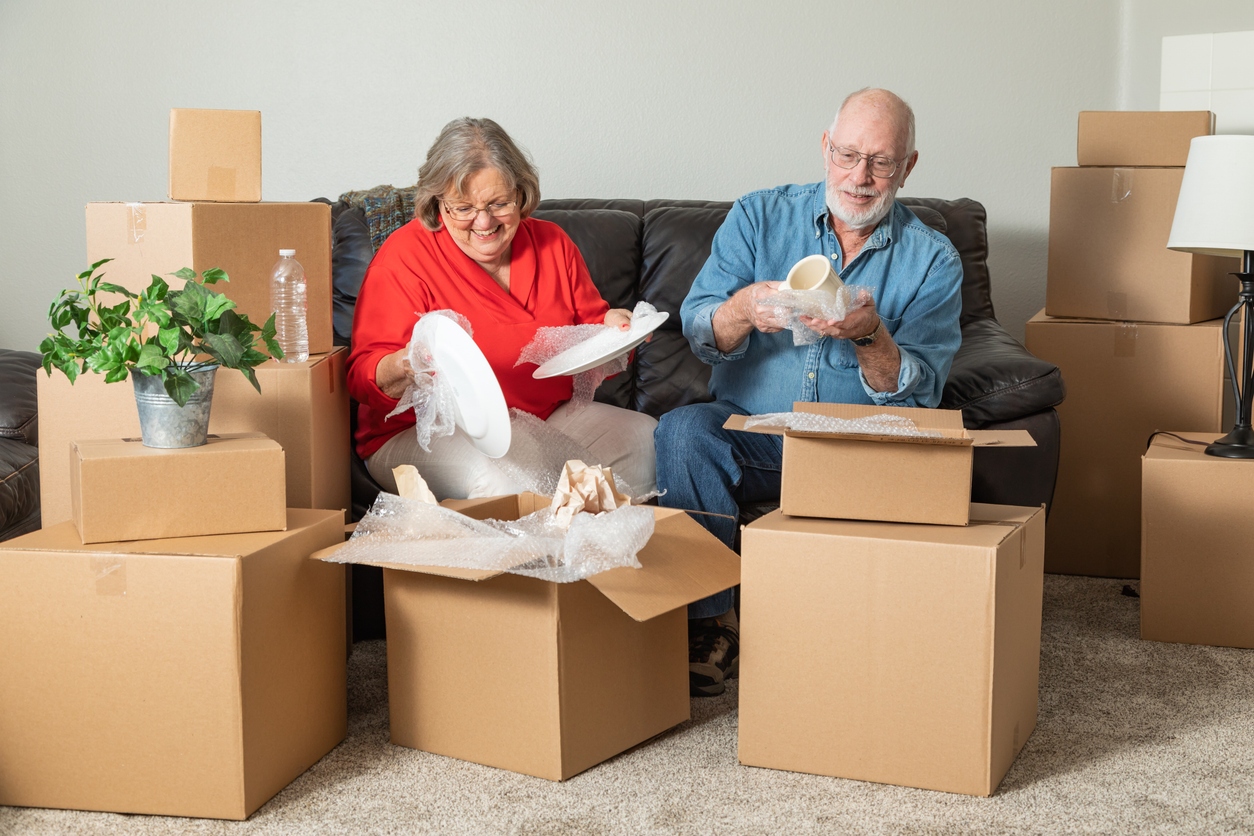 Senior Couple is Packing Boxes and Preparing for a Move