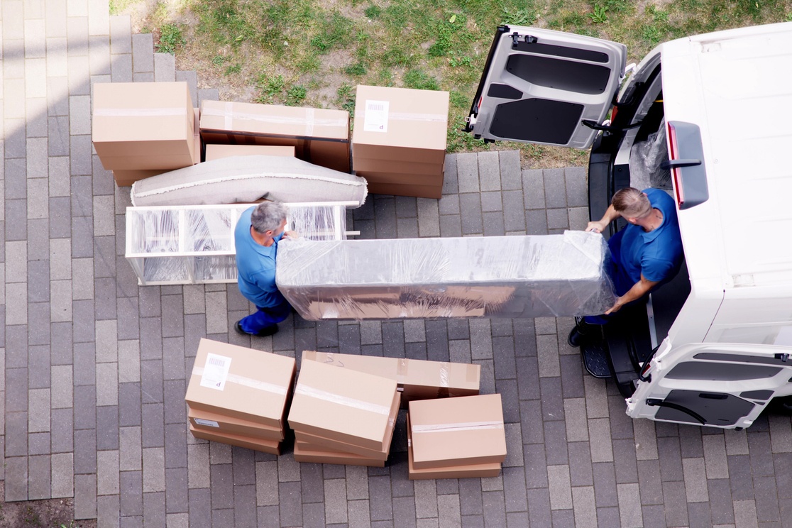 Team of Movers Loading Furniture into a Moving Truck